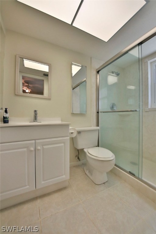 17520 Lebanon Road Fort Myers, FL 33967 - Photo 9 of 15 a bathroom with a toilet a sink a mirror and vanity