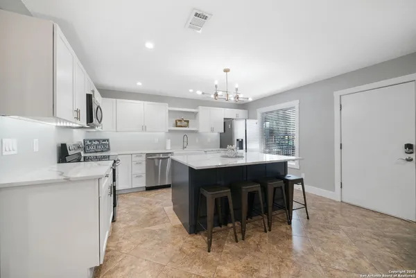 a kitchen with a sink and cabinets