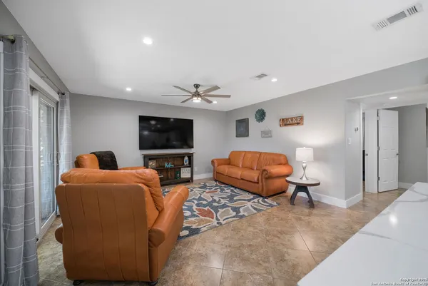 a living room with furniture and a large window