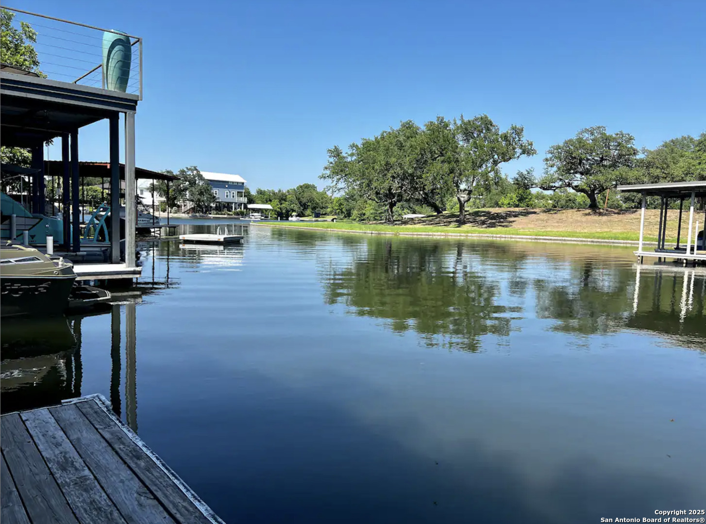 1500 Ranch Road 1431, Unit 103 Kingsland, TX 78639 - Photo 2 of 29 a view of a lake with boats and deck