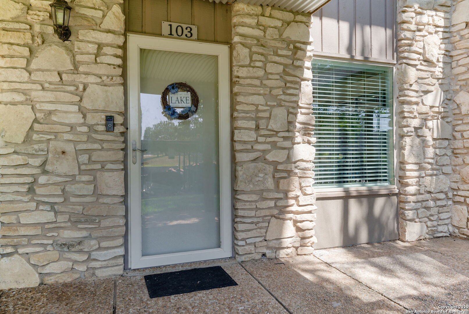 1500 Ranch Road 1431, Unit 103 Kingsland, TX 78639 - Photo 25 of 29 a front view of a house with an outdoor space