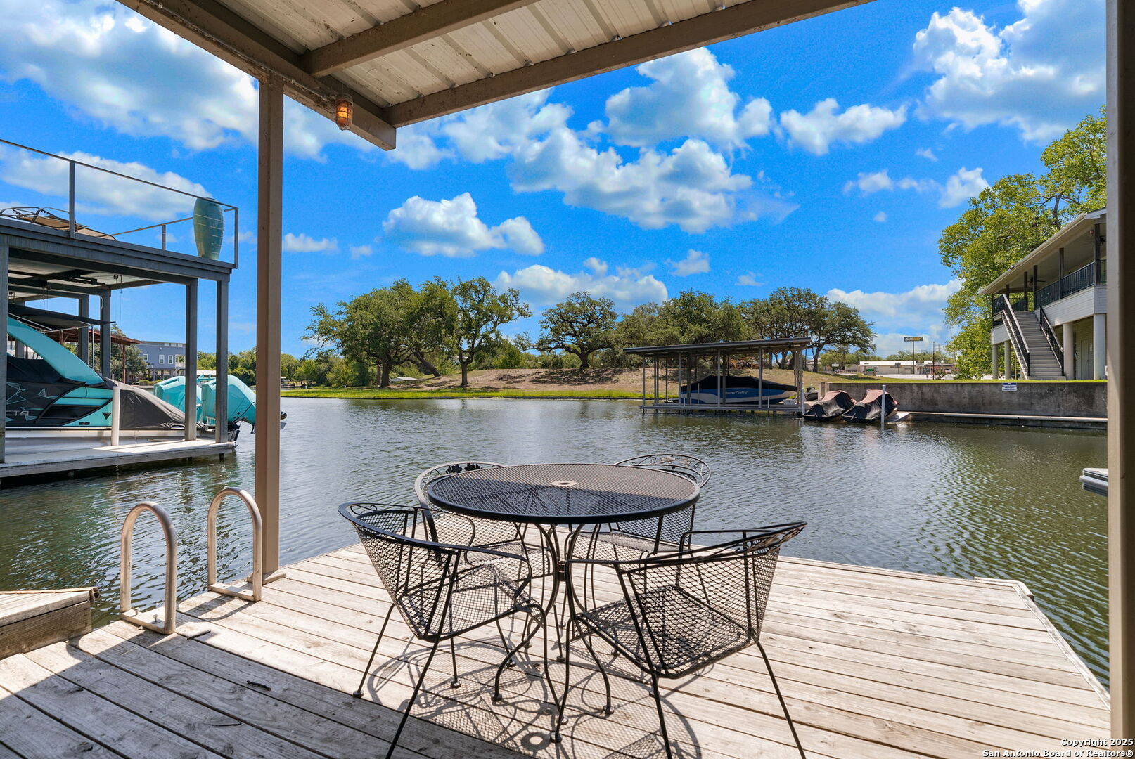 1500 Ranch Road 1431, Unit 103 Kingsland, TX 78639 - Photo 27 of 29 a view of a lake with sitting area
