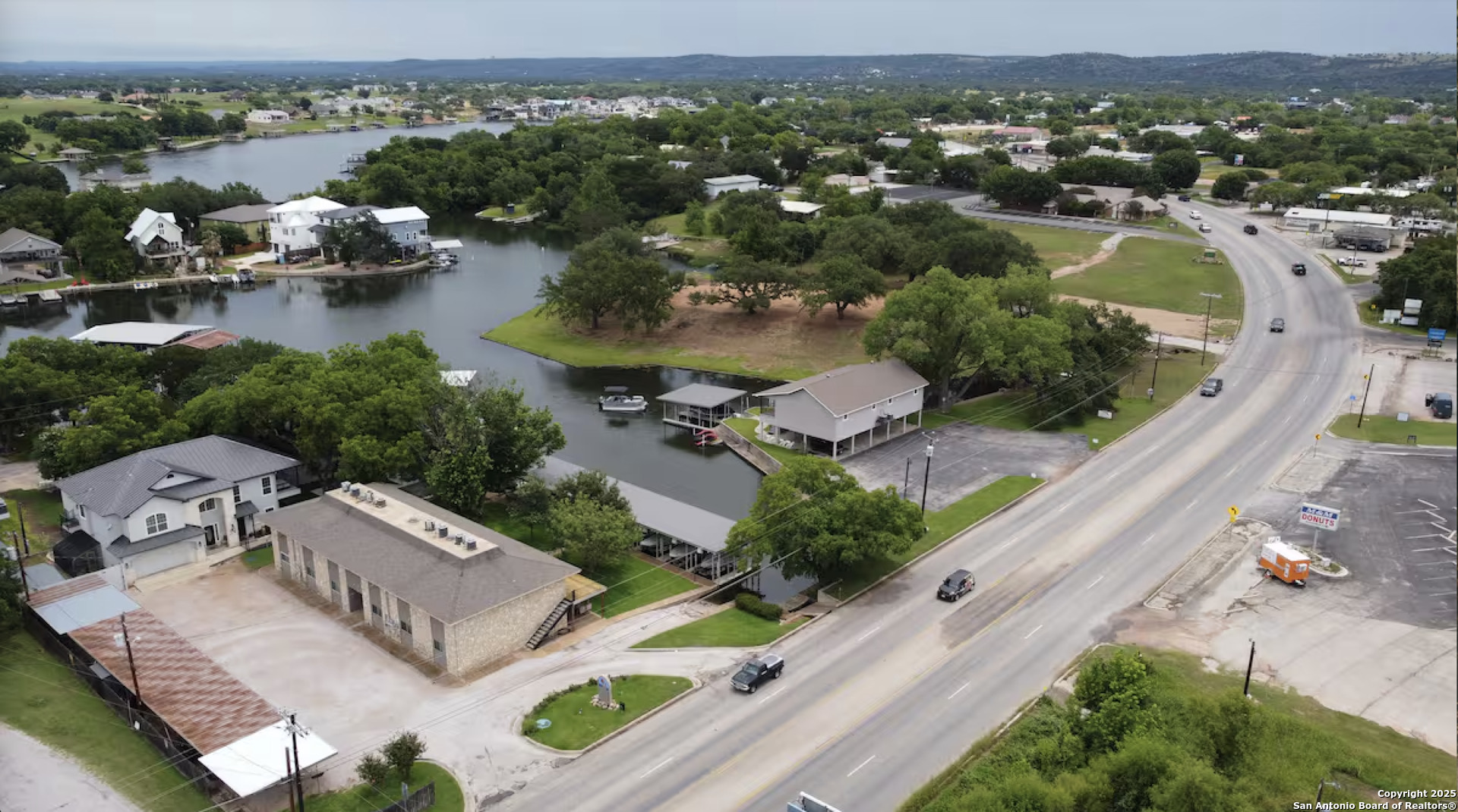 1500 Ranch Road 1431, Unit 103 Kingsland, TX 78639 - Photo 8 of 29 an aerial view of a city with lots of residential buildings ocean and mountain view in back