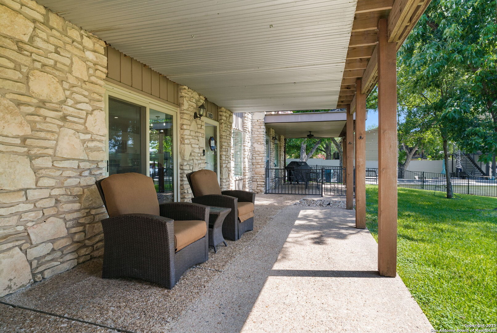 1500 Ranch Road 1431, Unit 103 Kingsland, TX 78639 - Photo 9 of 29 a view of a patio with chairs and table