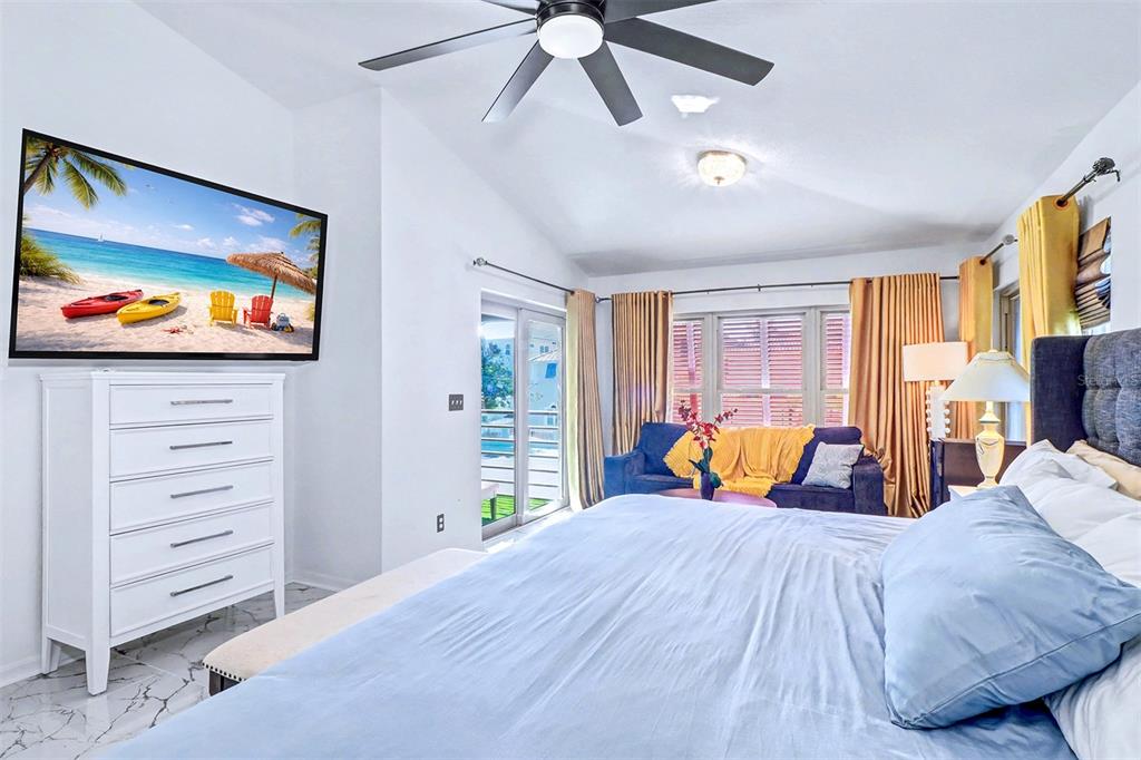 15517 Gulf Boulevard Redington Beach, FL 33708 - Photo 16 of 48 a bed room with a bed and a television