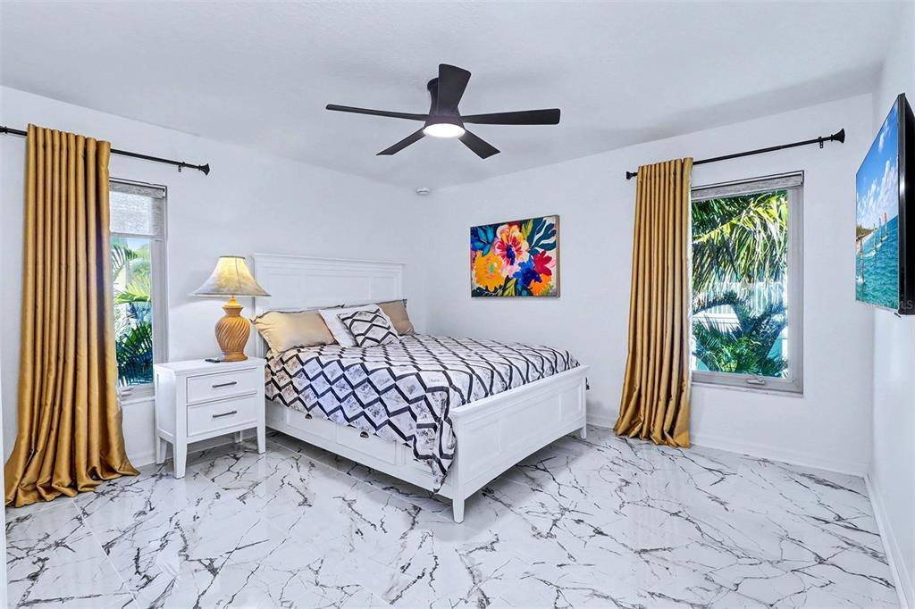 15517 Gulf Boulevard Redington Beach, FL 33708 - Photo 22 of 48 a bedroom with a bed and a window