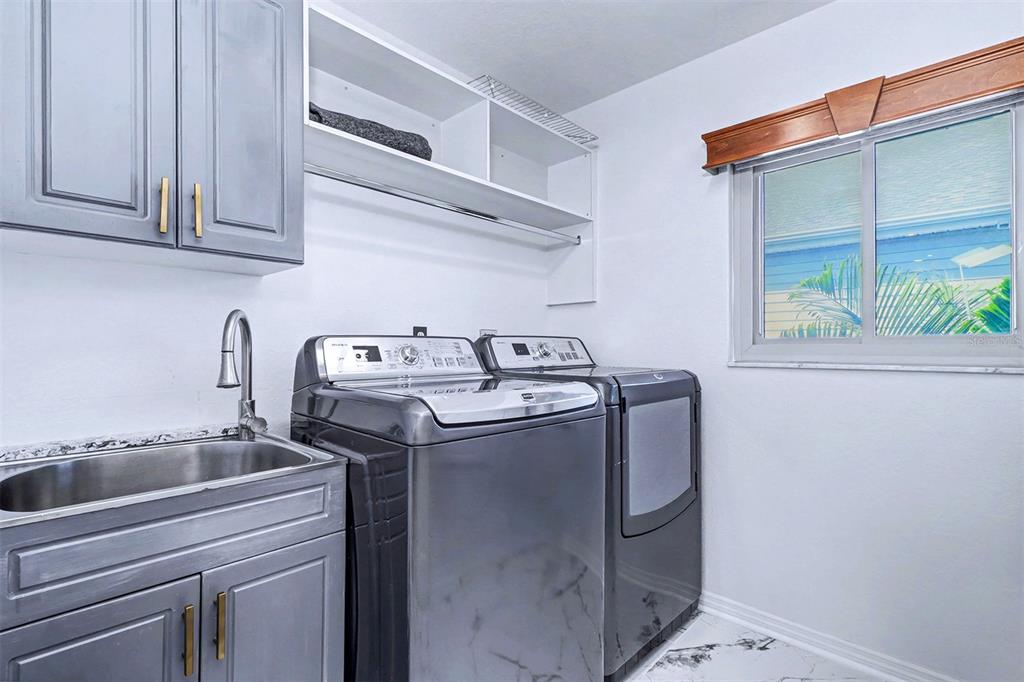 15517 Gulf Boulevard Redington Beach, FL 33708 - Photo 27 of 48 a utility room with dryer and washer