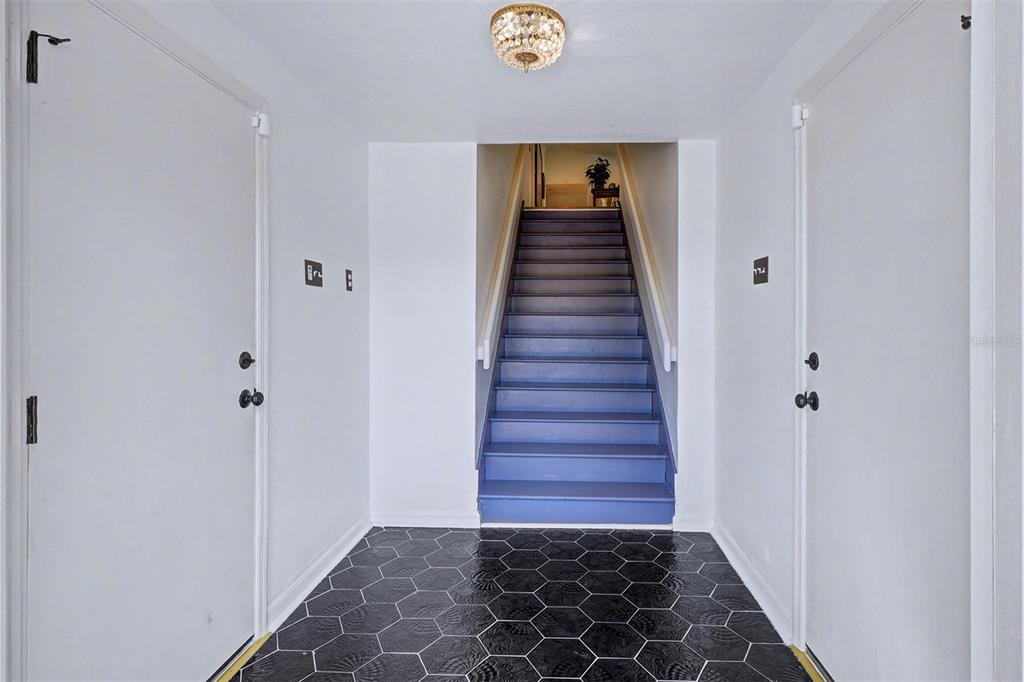 15517 Gulf Boulevard Redington Beach, FL 33708 - Photo 3 of 48 a view of a hallway with wooden floor and entryway