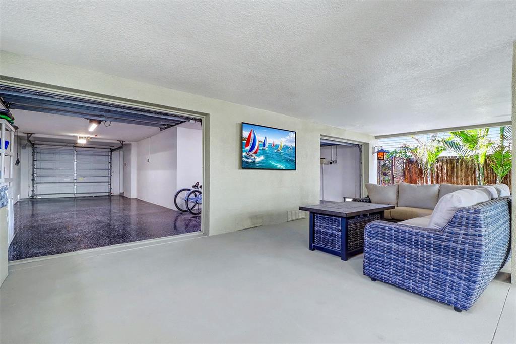 15517 Gulf Boulevard Redington Beach, FL 33708 - Photo 36 of 48 a living room with furniture and a floor to ceiling window