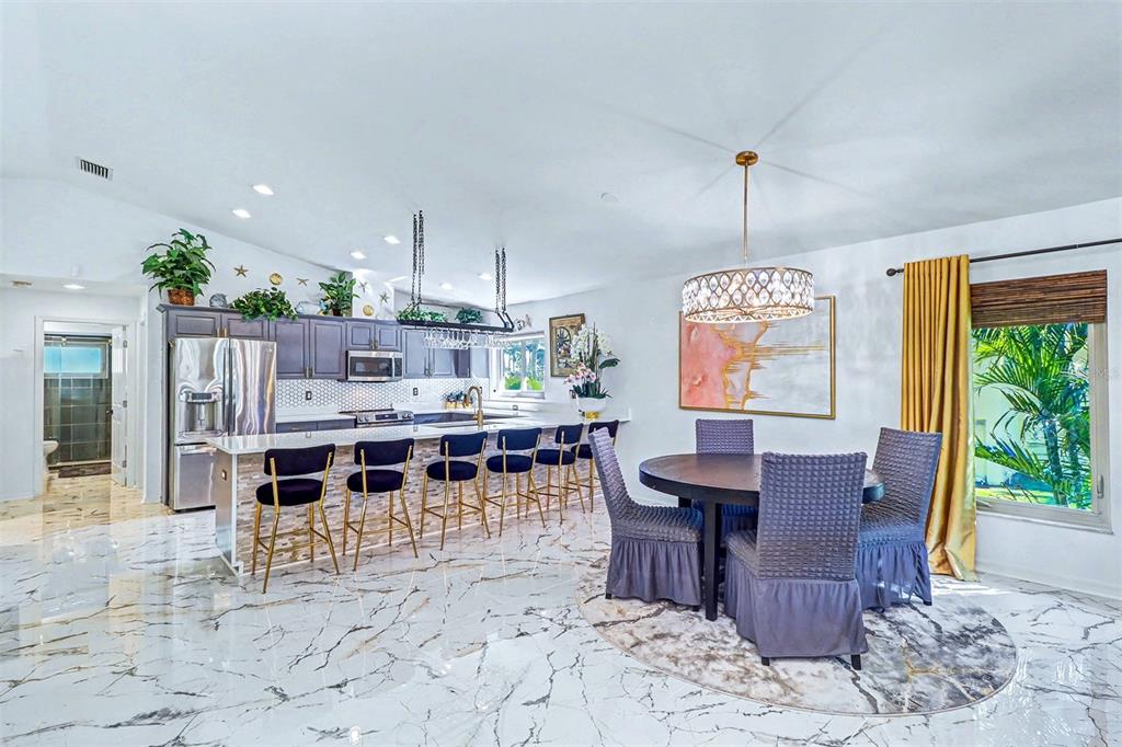 15517 Gulf Boulevard Redington Beach, FL 33708 - Photo 9 of 48 a view of a dining room with furniture window and outside view