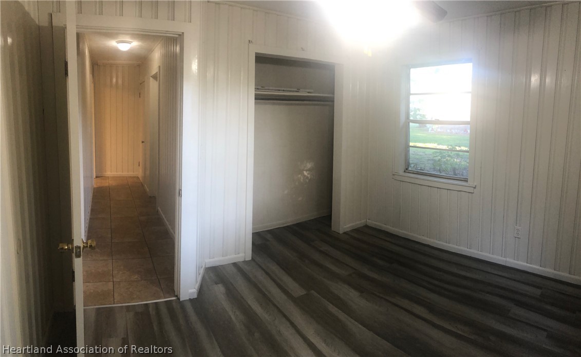 313 Heard Bridge Road Wauchula, FL 33873 - Photo 13 of 20 a view of an empty room with wooden floor and a window