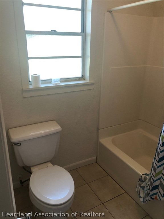 313 Heard Bridge Road Wauchula, FL 33873 - Photo 17 of 20 a white toilet sitting next to a bath tub