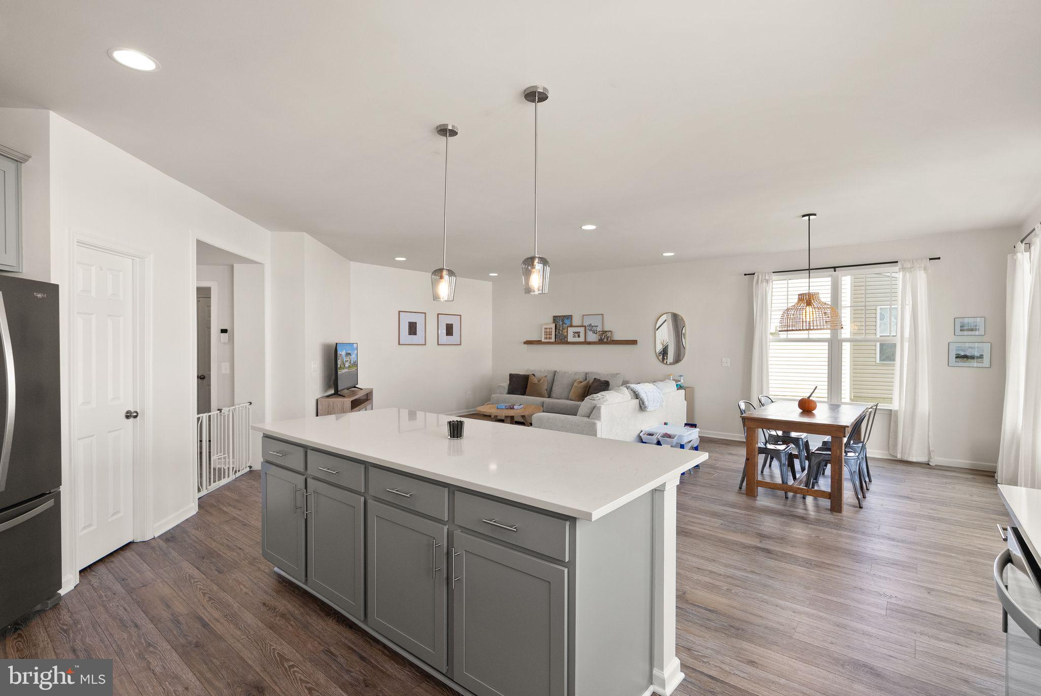 131 Interlace Way Stephenson, VA 22656 - Photo 11 of 71 a large white kitchen with a table and chairs