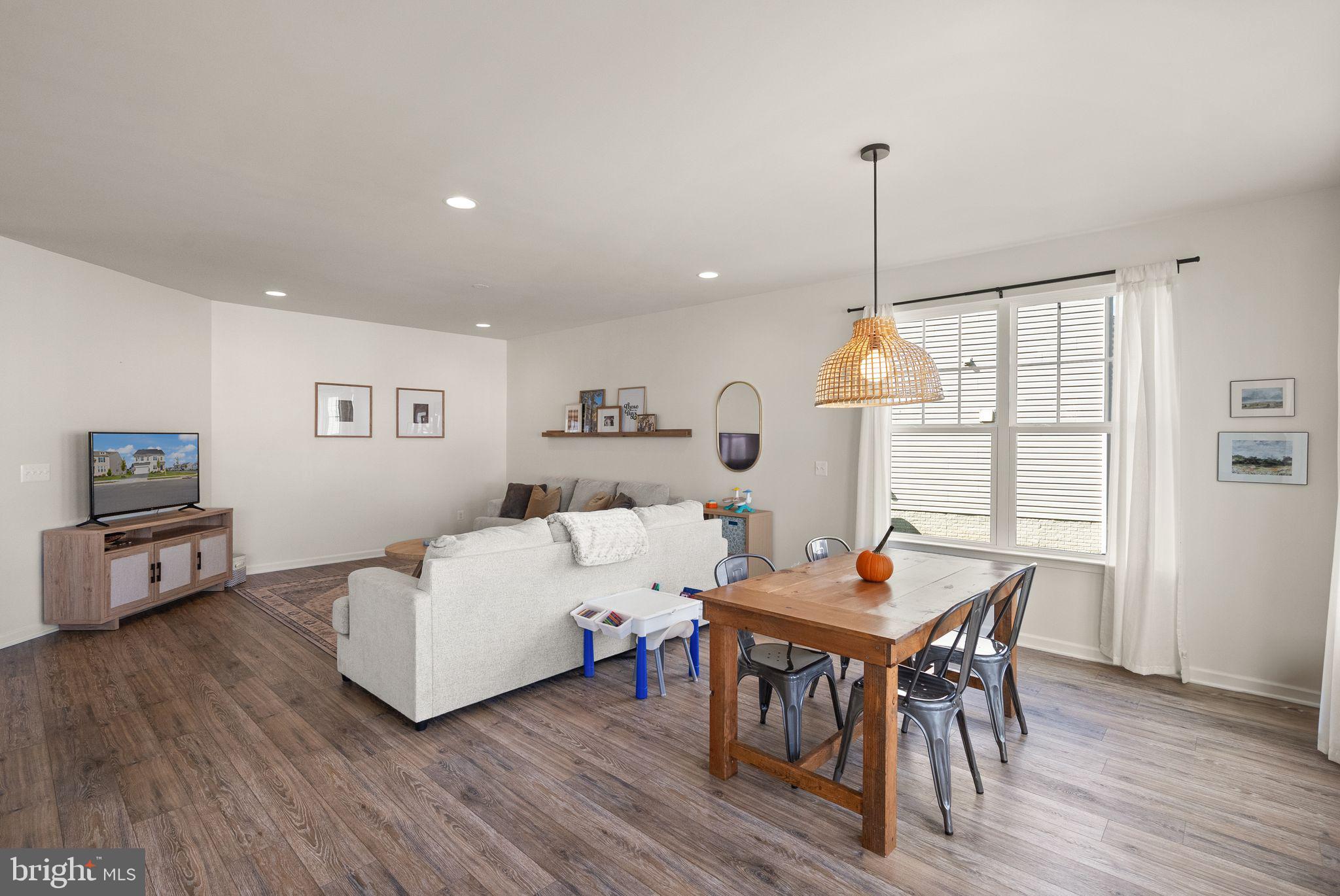 131 Interlace Way Stephenson, VA 22656 - Photo 14 of 71 a living room with furniture a table and a flat screen tv