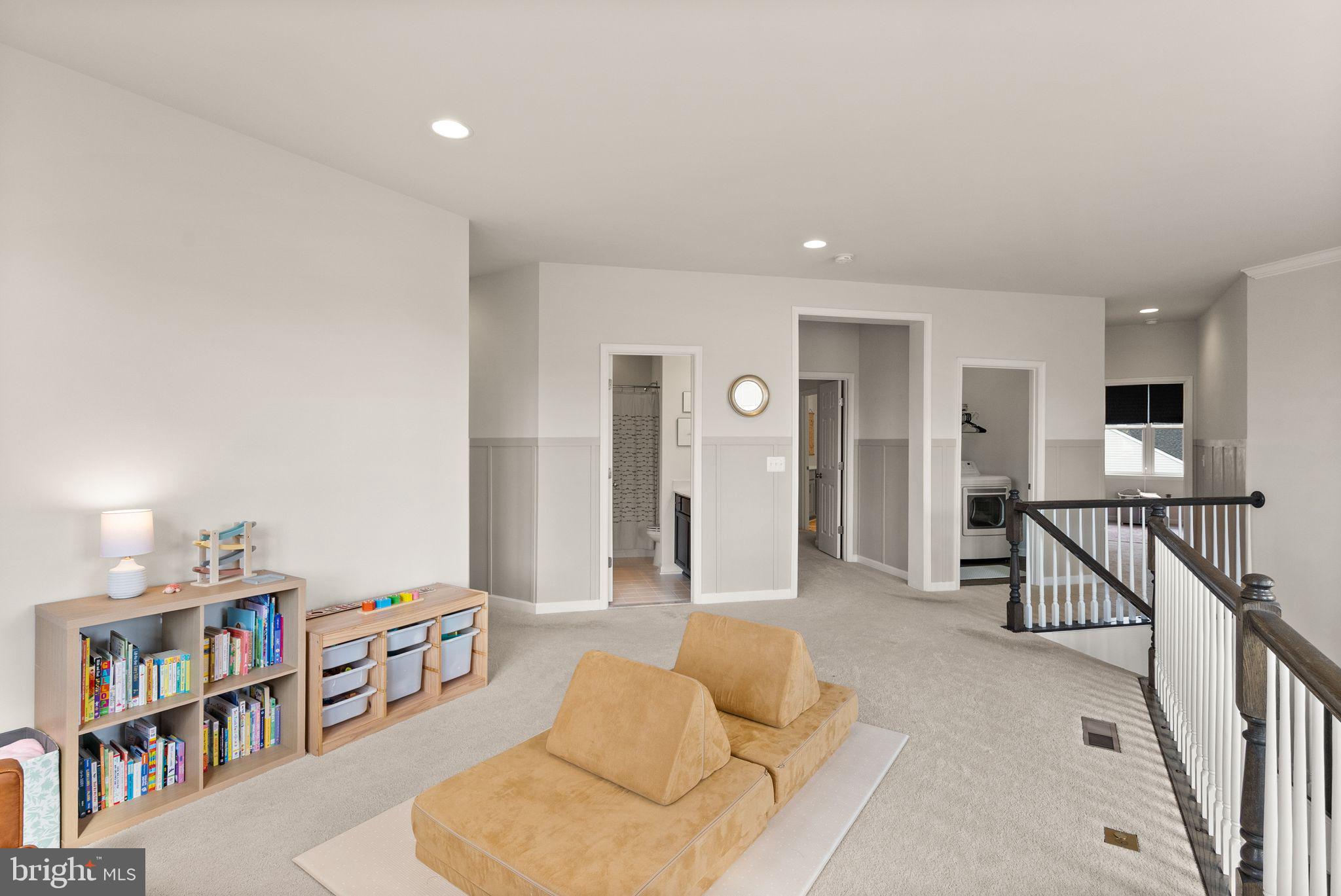 131 Interlace Way Stephenson, VA 22656 - Photo 24 of 71 a living room with furniture and a book shelf