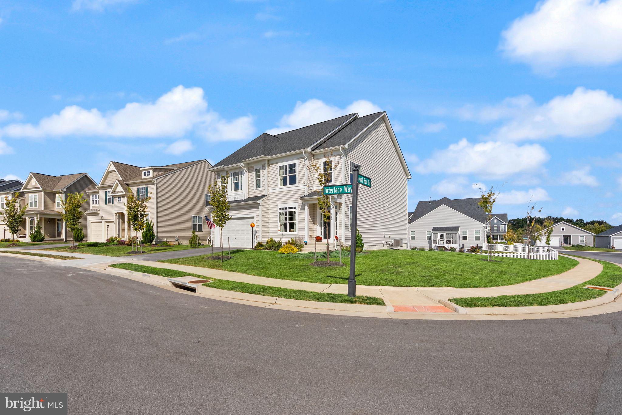 131 Interlace Way Stephenson, VA 22656 - Photo 3 of 71 a view of a big house with a big yard and large trees