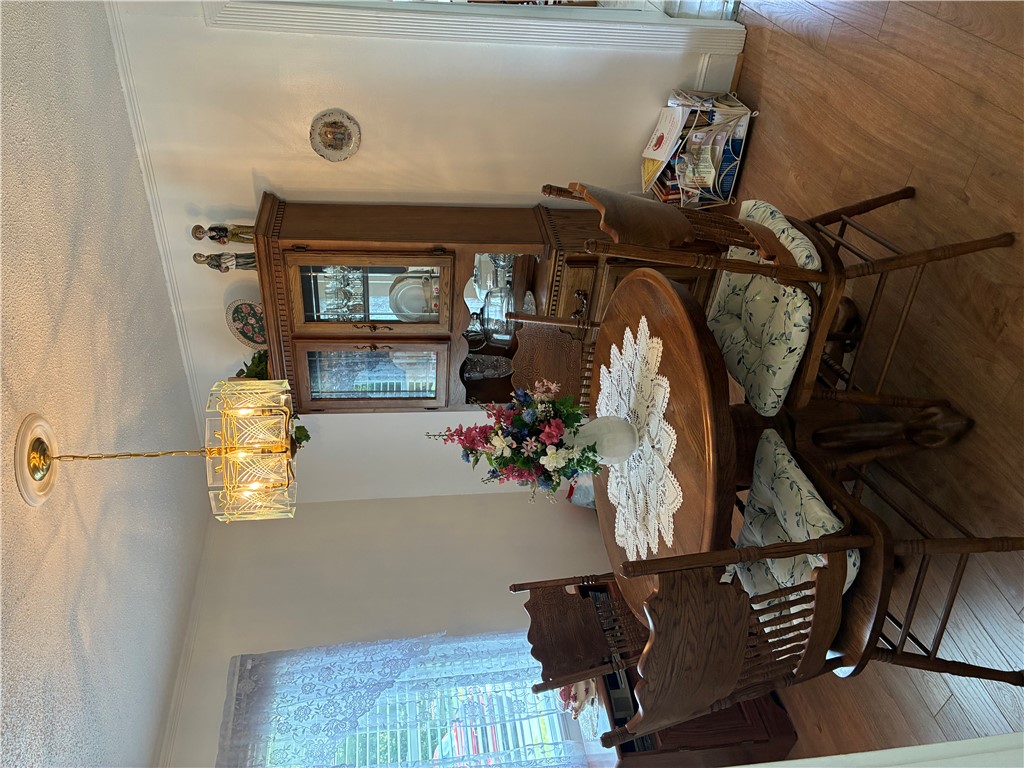 3407 New Pond Road Anderson, SC 29626 - Photo 6 of 16 Hardwood floors and a sophisticated chandelier define this intimate dining area.