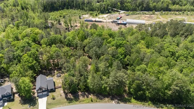 a backyard of a house with a yard and outdoor seating