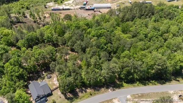 an aerial view of a house with yard