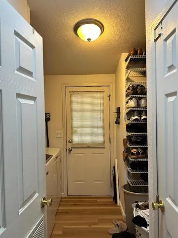 a view of a bathroom with a shower and a sink