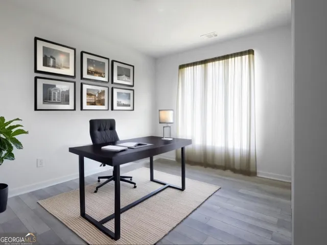 a workspace with furniture window and wooden floor