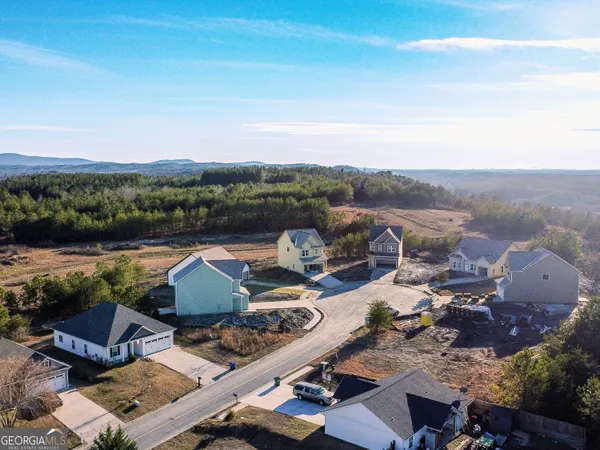 an aerial view of a house with outdoor space