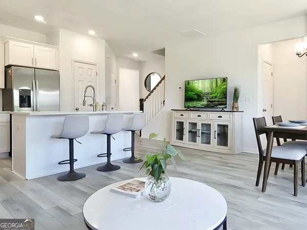 a living room with fireplace furniture and a flat screen tv