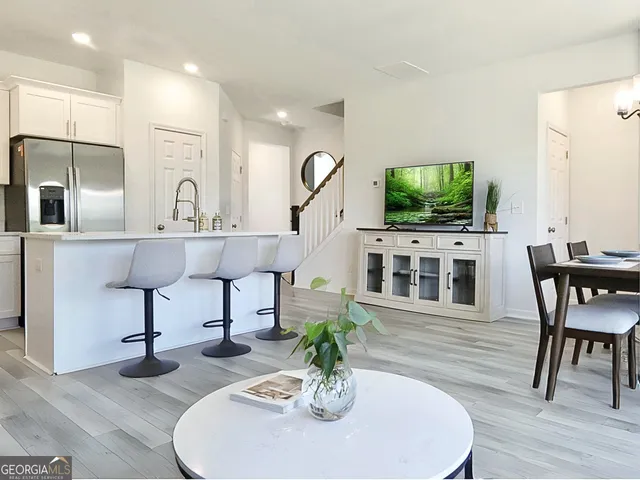 a living room with fireplace furniture and a flat screen tv