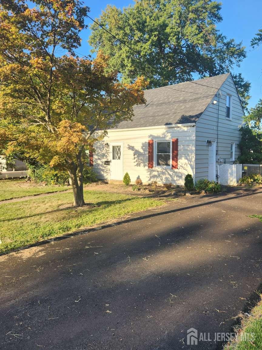 223 Plainfield Avenue Edison, NJ 08817 - Photo 1 of 6 a front view of a house with a yard and garage