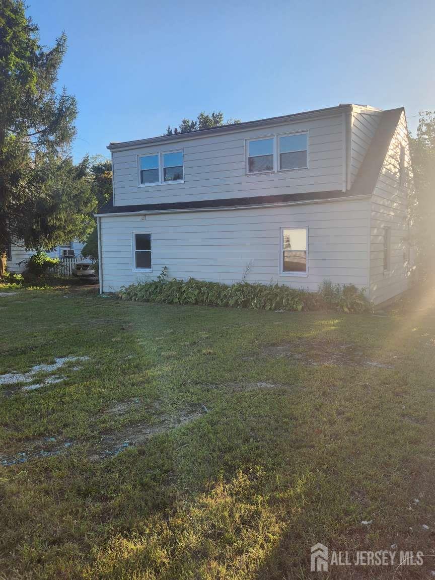 223 Plainfield Avenue Edison, NJ 08817 - Photo 5 of 6 a view of a house with a yard