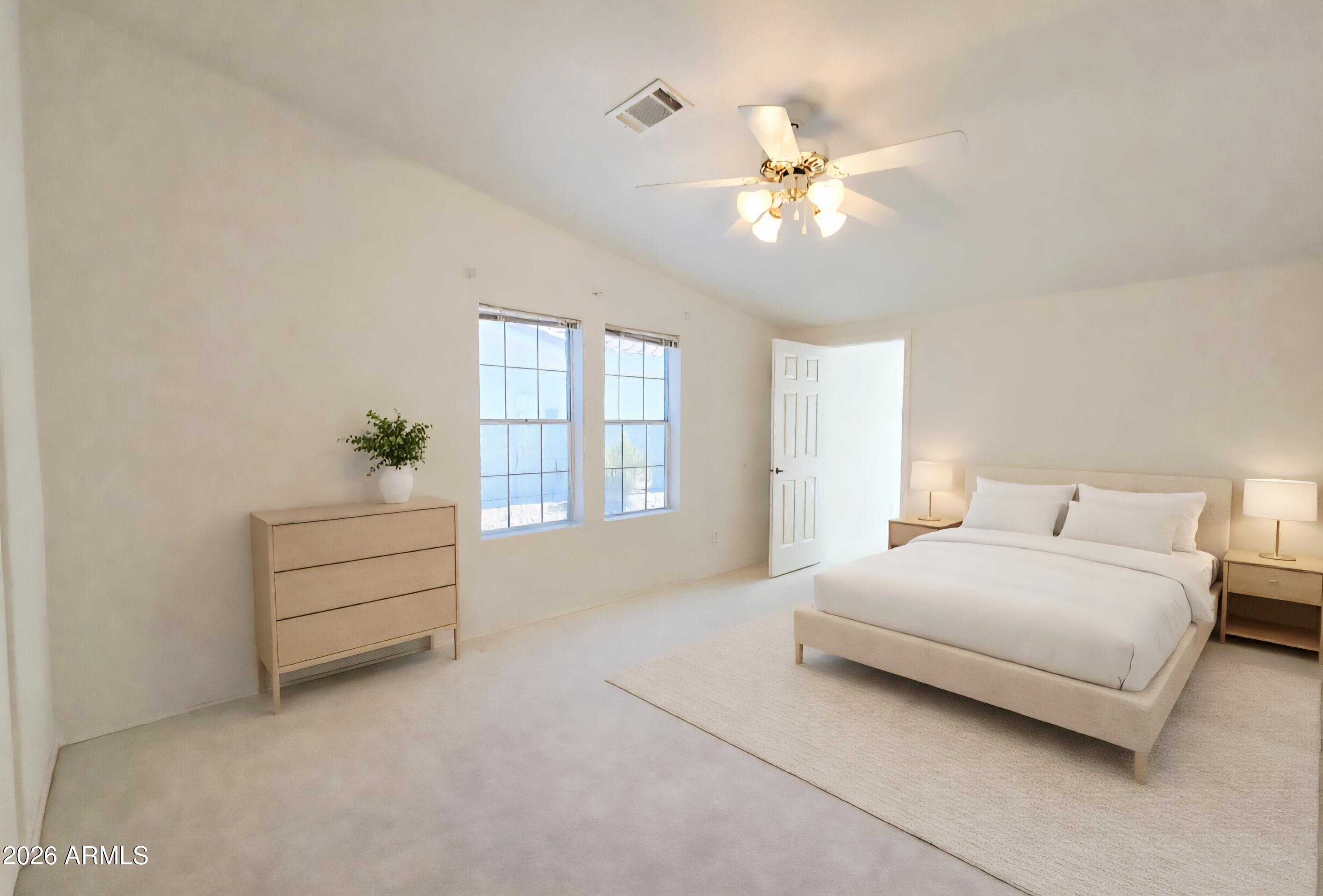 3301 South Goldfield Road, Unit 3004 Apache Junction, AZ 85119 - Photo 23 of 67 a bedroom with a bed and a chandelier