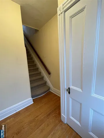 a view of entryway with wooden floor