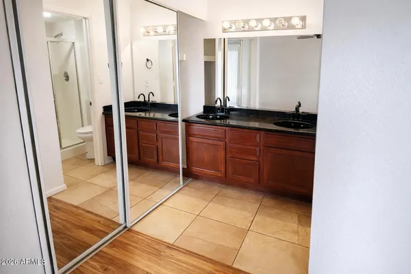 a room with a sink and a mirror
