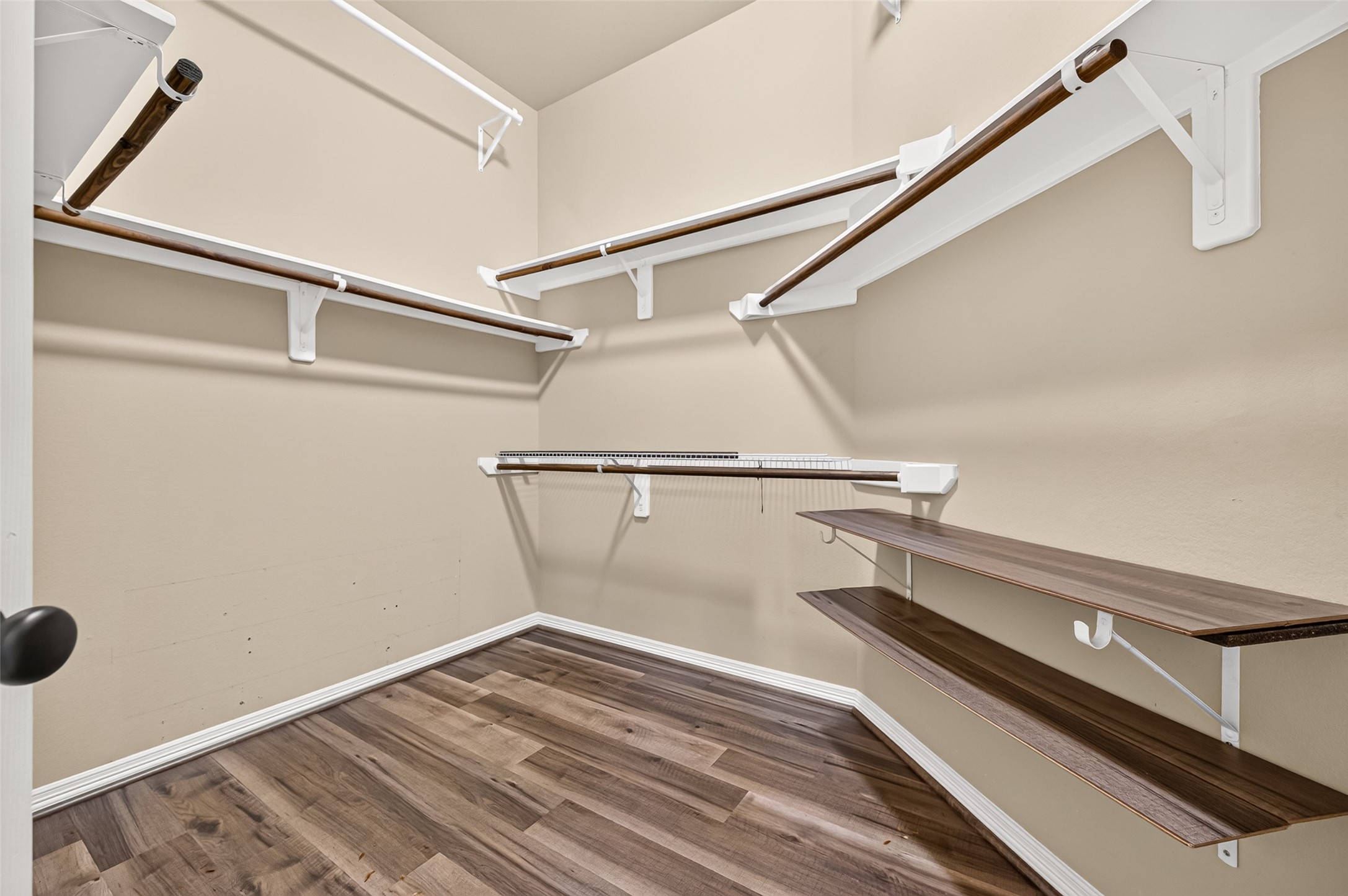 4314 Kent Ranch Court Katy, TX 77494 - Photo 32 of 49 Primary walk-in closet with multiple hanging rods and shelving.