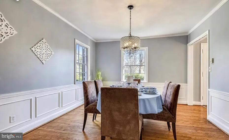 5806 Kenmore Road Baltimore, MD 21210 - Photo 13 of 35 a view of a dining room with furniture window and wooden floor