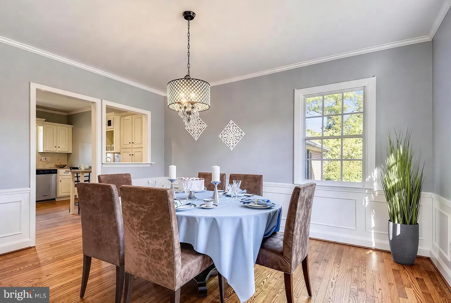 5806 Kenmore Road Baltimore, MD 21210 - Photo 14 of 35 a view of a dining room with furniture window and wooden floor
