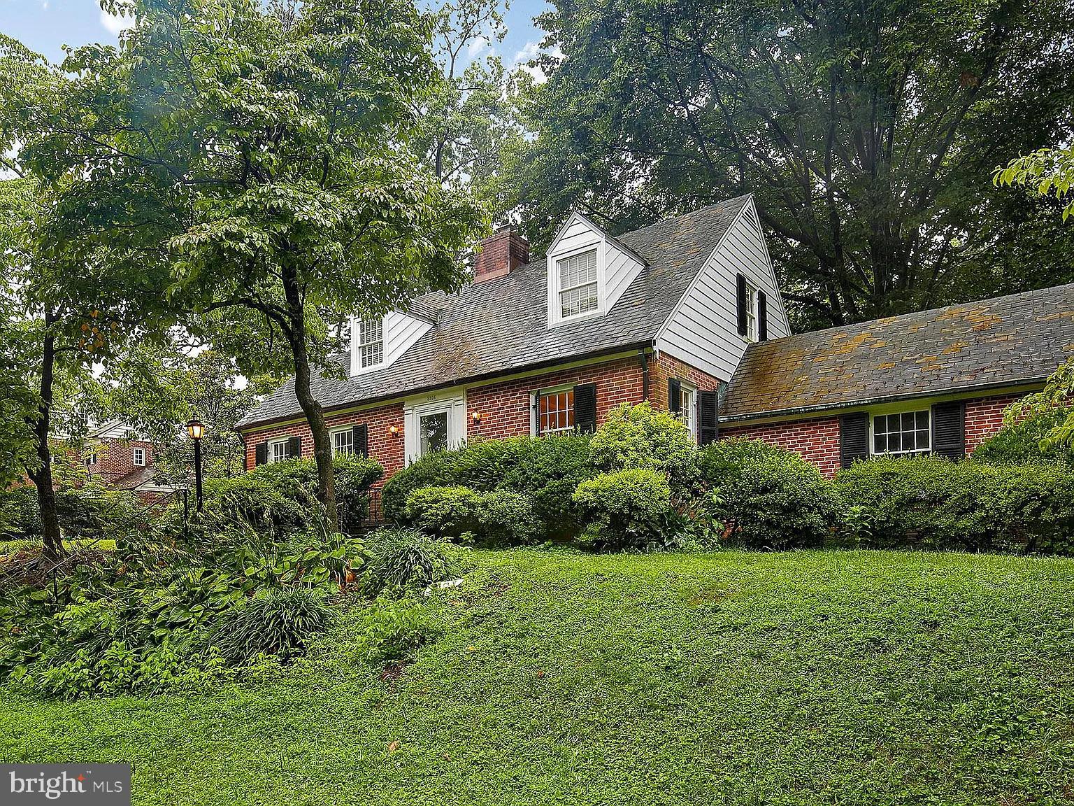 5806 Kenmore Road Baltimore, MD 21210 - Photo 2 of 35 a view of a white house next to a yard with big trees