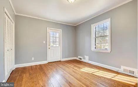 5806 Kenmore Road Baltimore, MD 21210 - Photo 22 of 35 a view of empty room with wooden floor