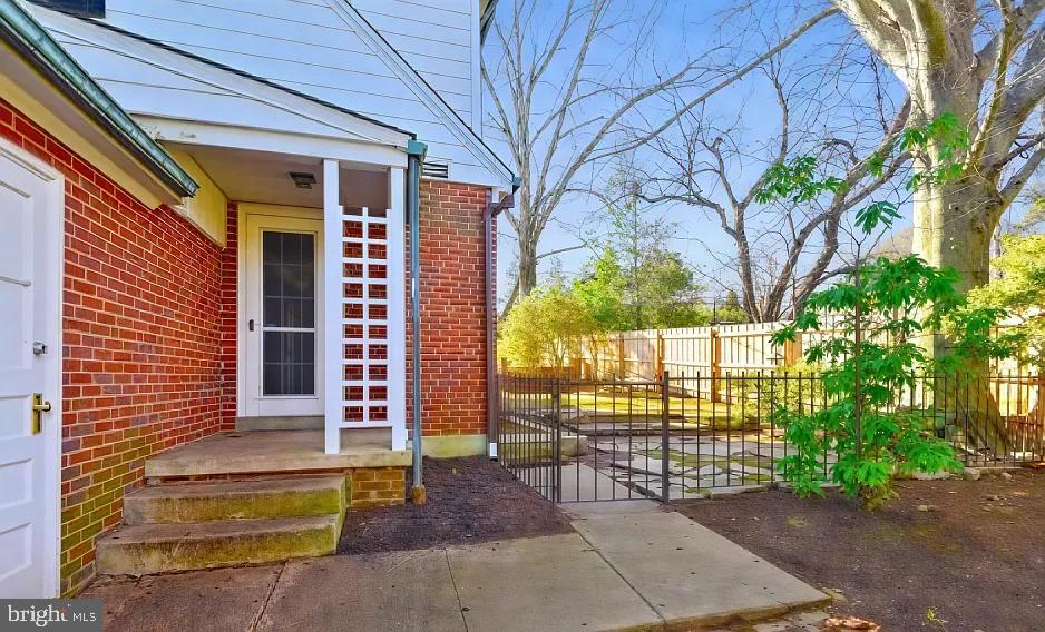 5806 Kenmore Road Baltimore, MD 21210 - Photo 29 of 35 a view of a house with a tree and wooden fence