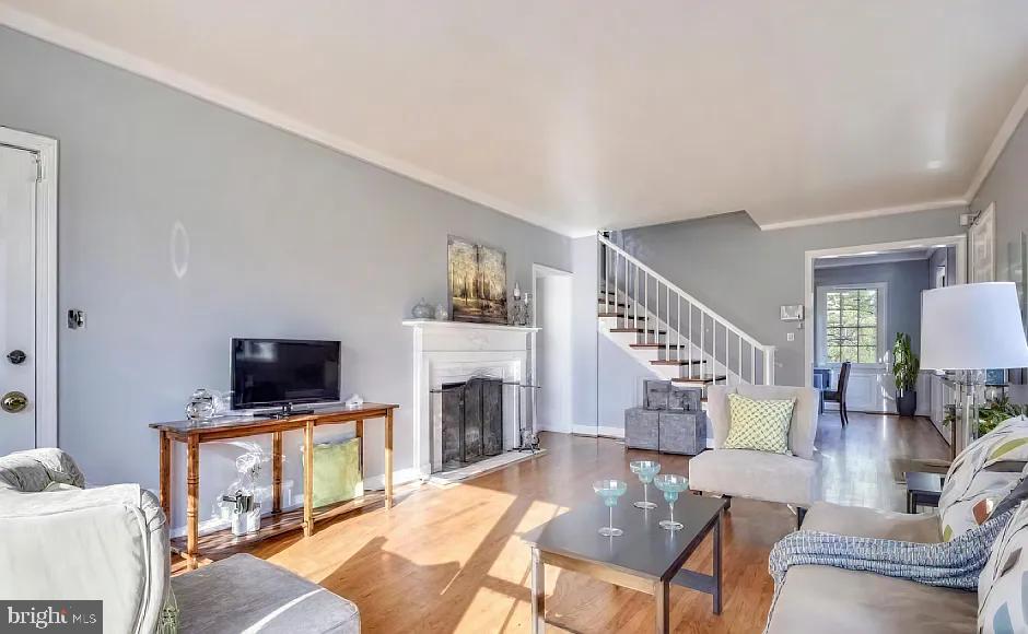 5806 Kenmore Road Baltimore, MD 21210 - Photo 9 of 35 a living room with fireplace furniture and a flat screen tv