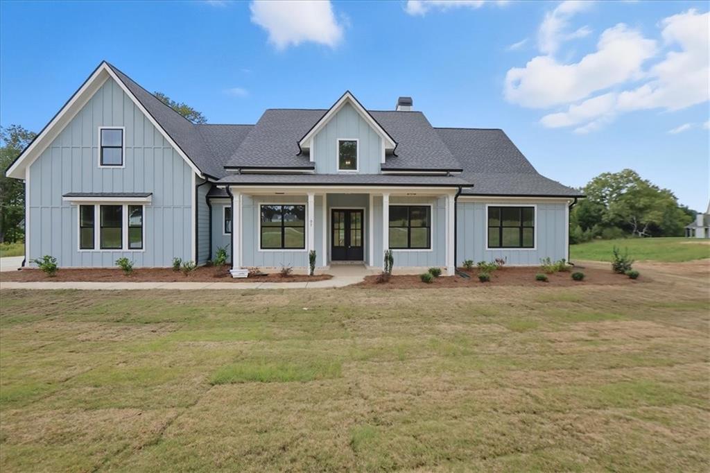 95 Old Town Road Dacula, GA 30019 - Photo 74 of 74 a front view of a house with swimming pool and porch