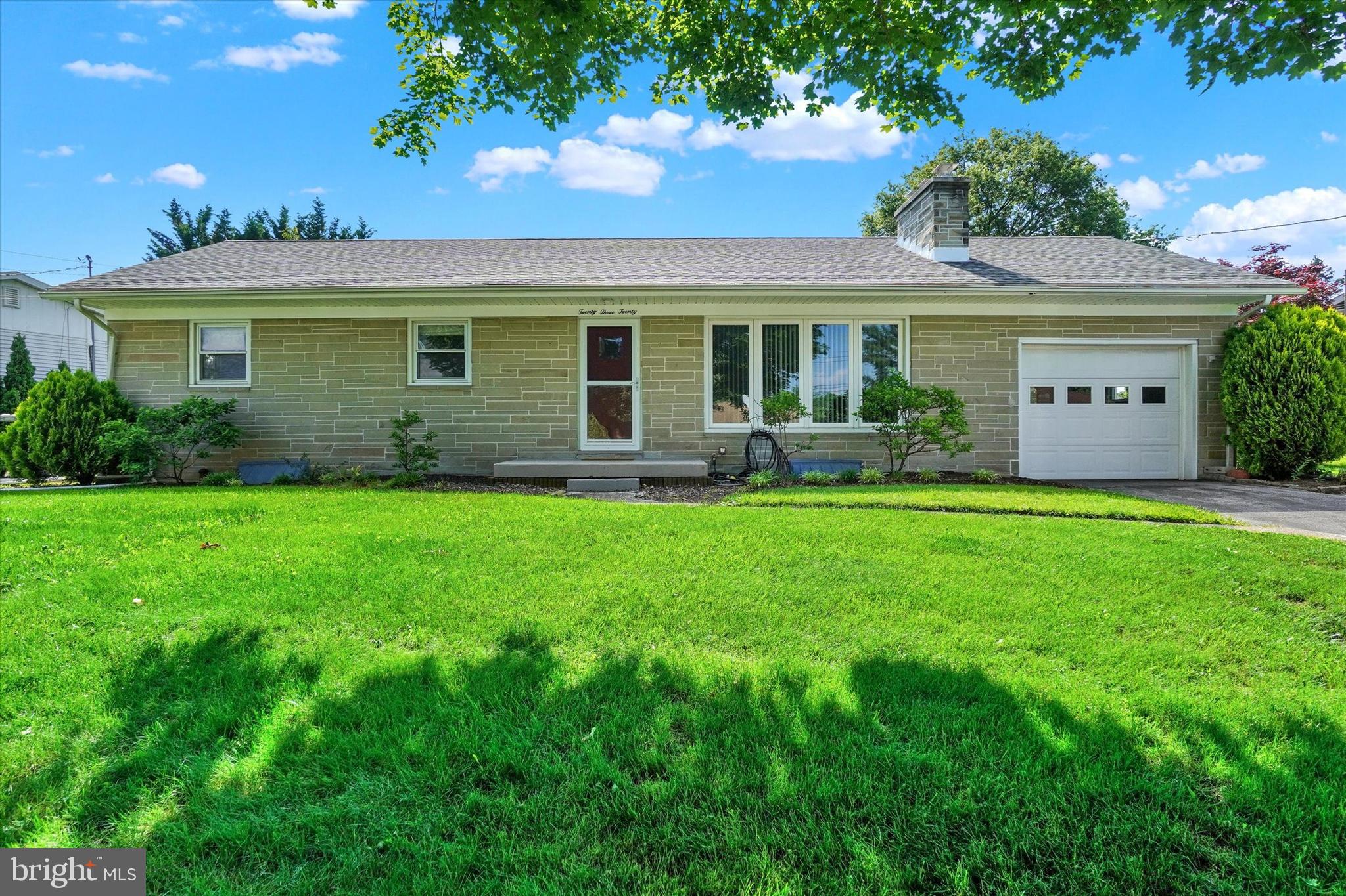 2320 Sycamore Road York, PA 17408 - Photo 1 of 26 a front view of a house with garden and outdoor seating
