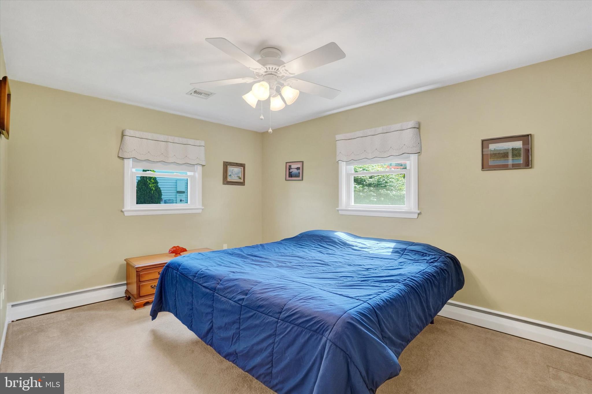 2320 Sycamore Road York, PA 17408 - Photo 11 of 26 a bedroom with a bed and a chandelier
