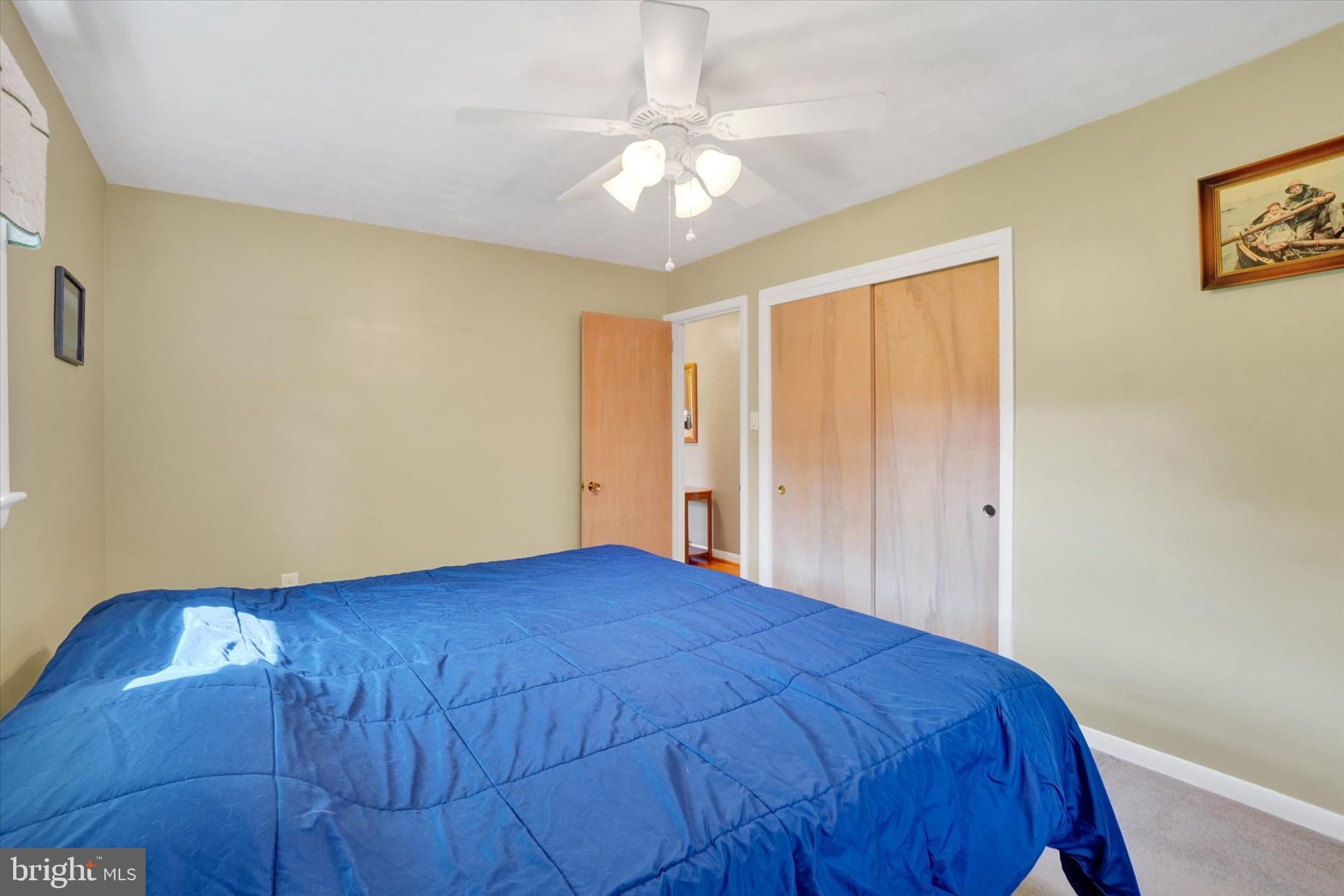 2320 Sycamore Road York, PA 17408 - Photo 12 of 26 a bedroom with a bed and a chandelier