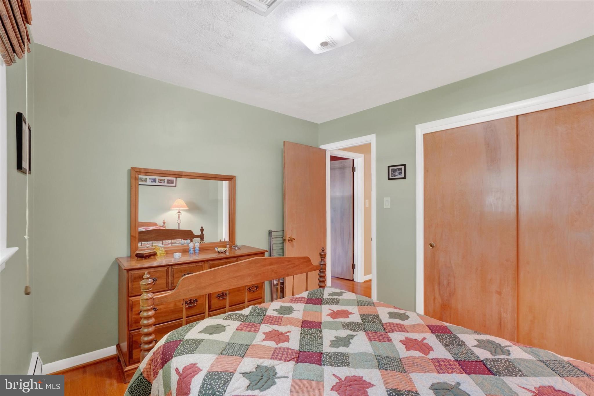 2320 Sycamore Road York, PA 17408 - Photo 16 of 26 a bedroom with a bed and a dresser
