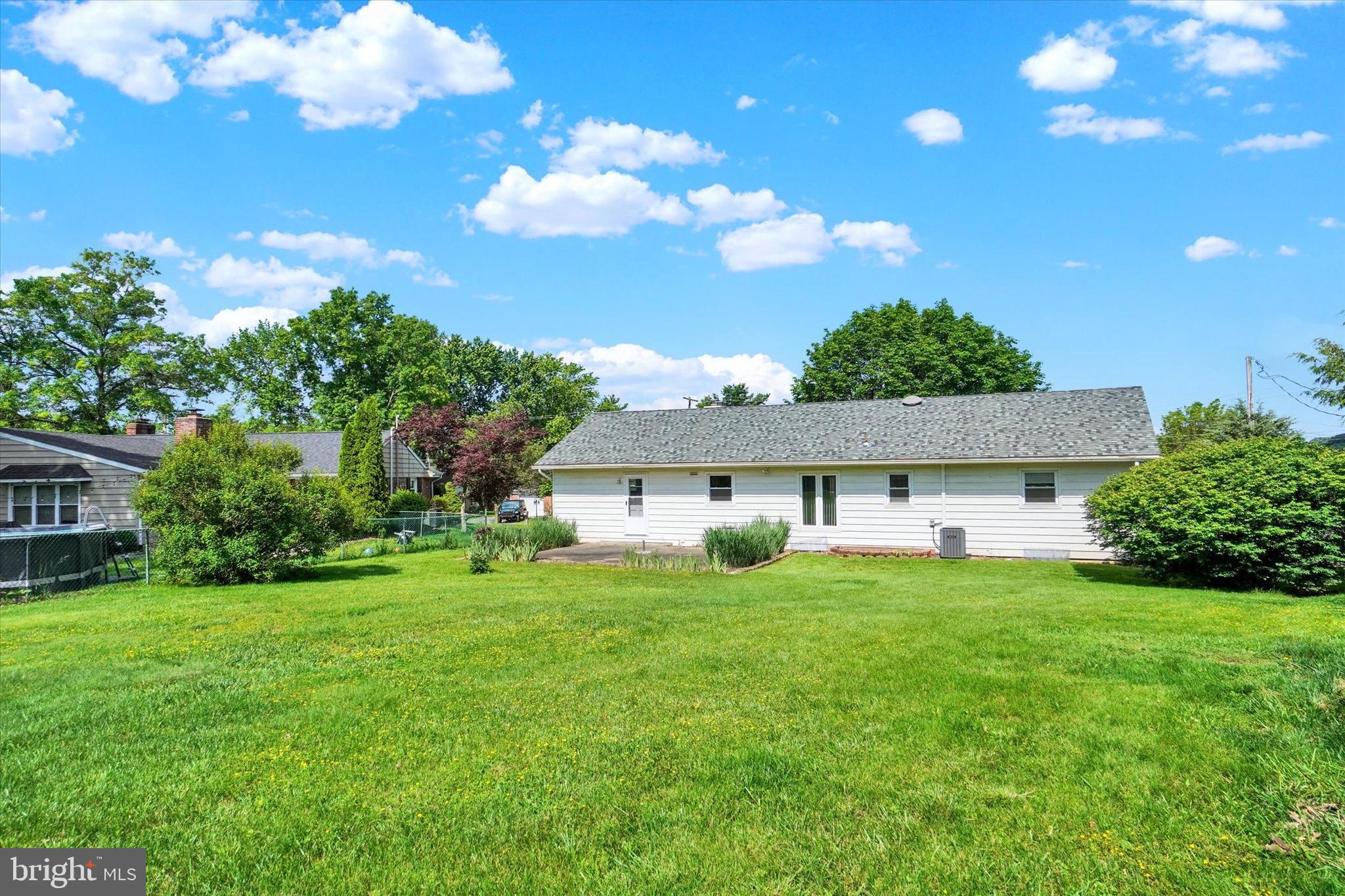 2320 Sycamore Road York, PA 17408 - Photo 20 of 26 a view of a house with a big yard and potted plants