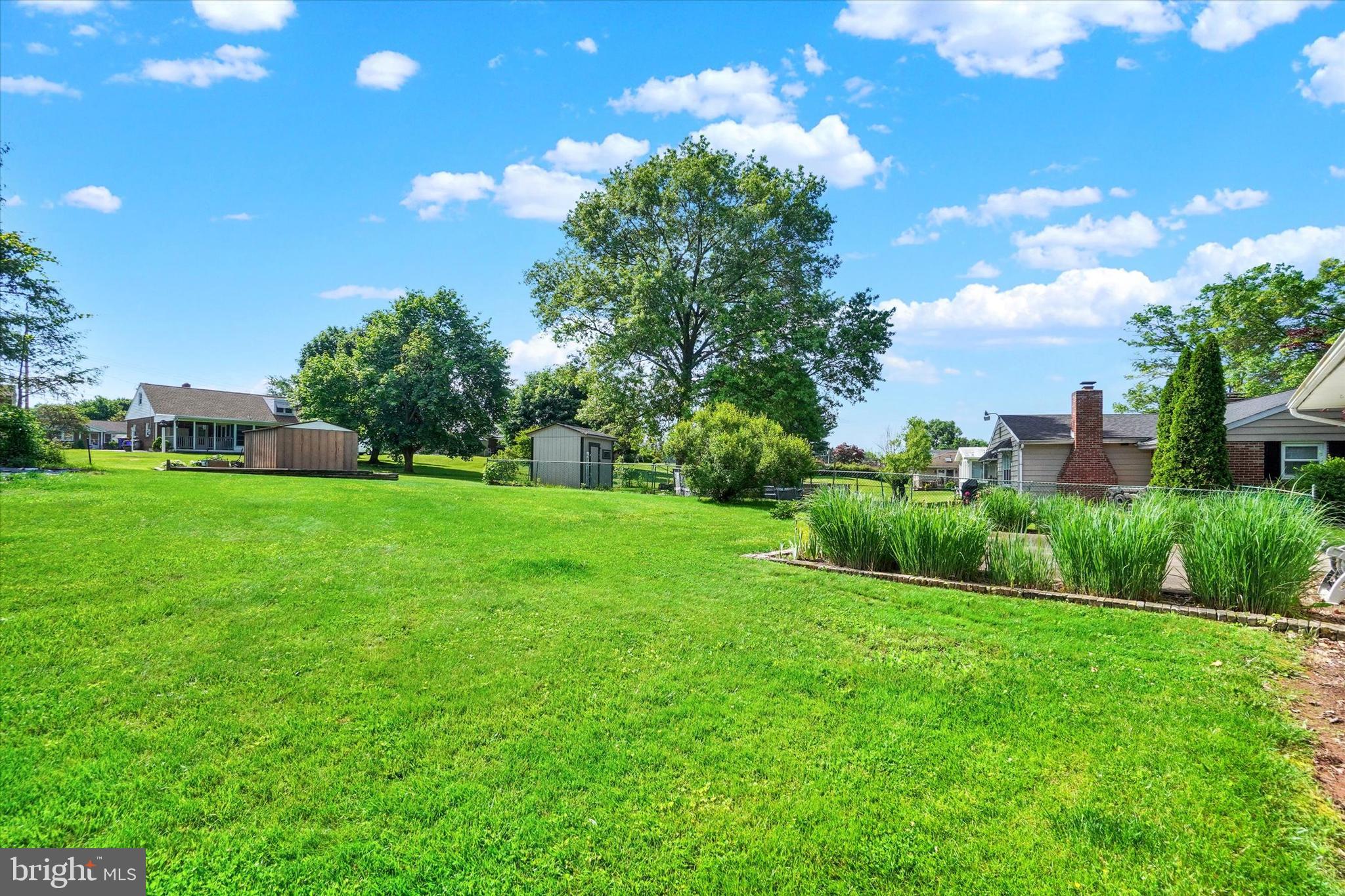 2320 Sycamore Road York, PA 17408 - Photo 21 of 26 a view of a garden with a building in the background