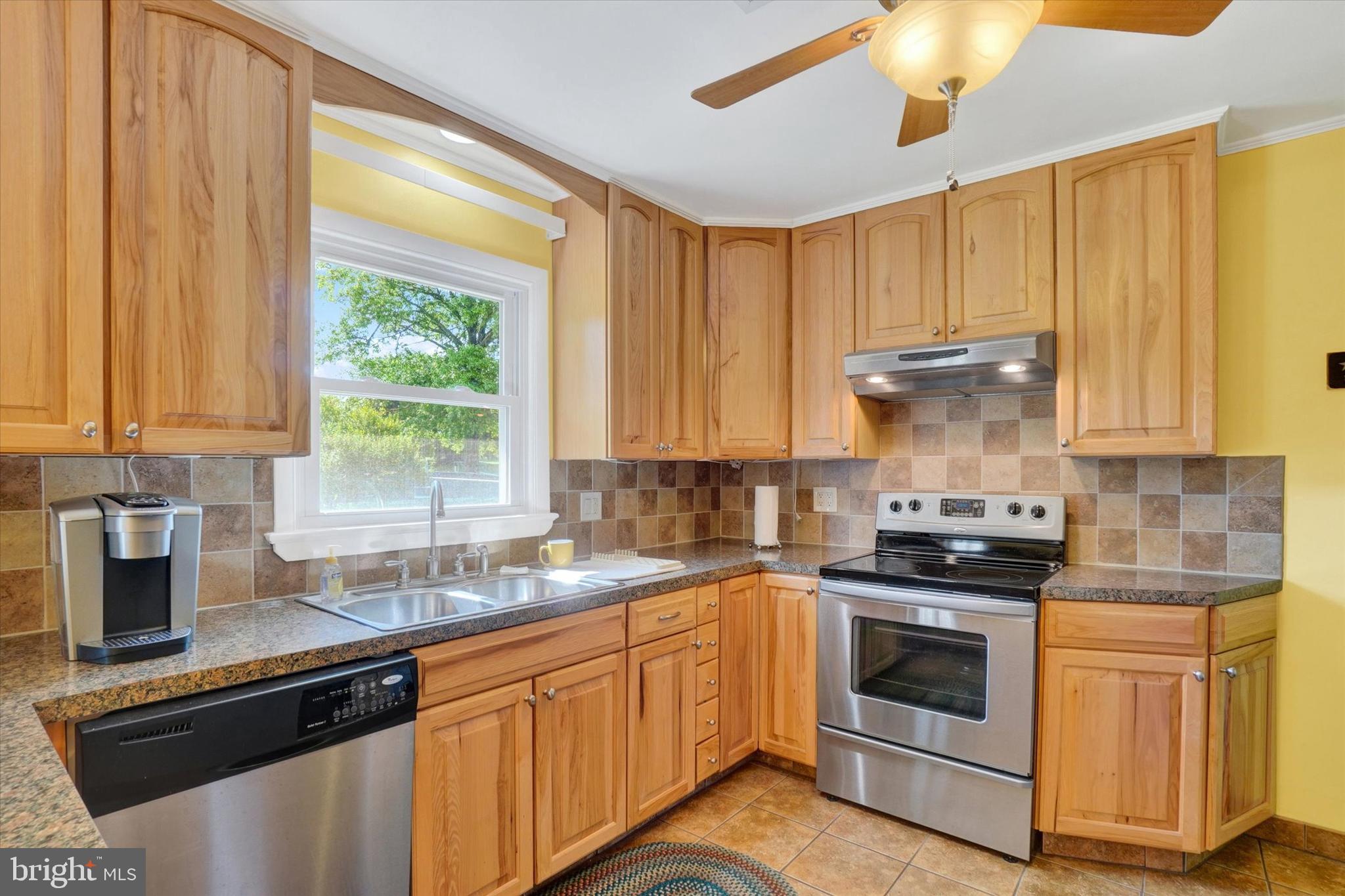 2320 Sycamore Road York, PA 17408 - Photo 7 of 26 a kitchen with a stove a sink and cabinets