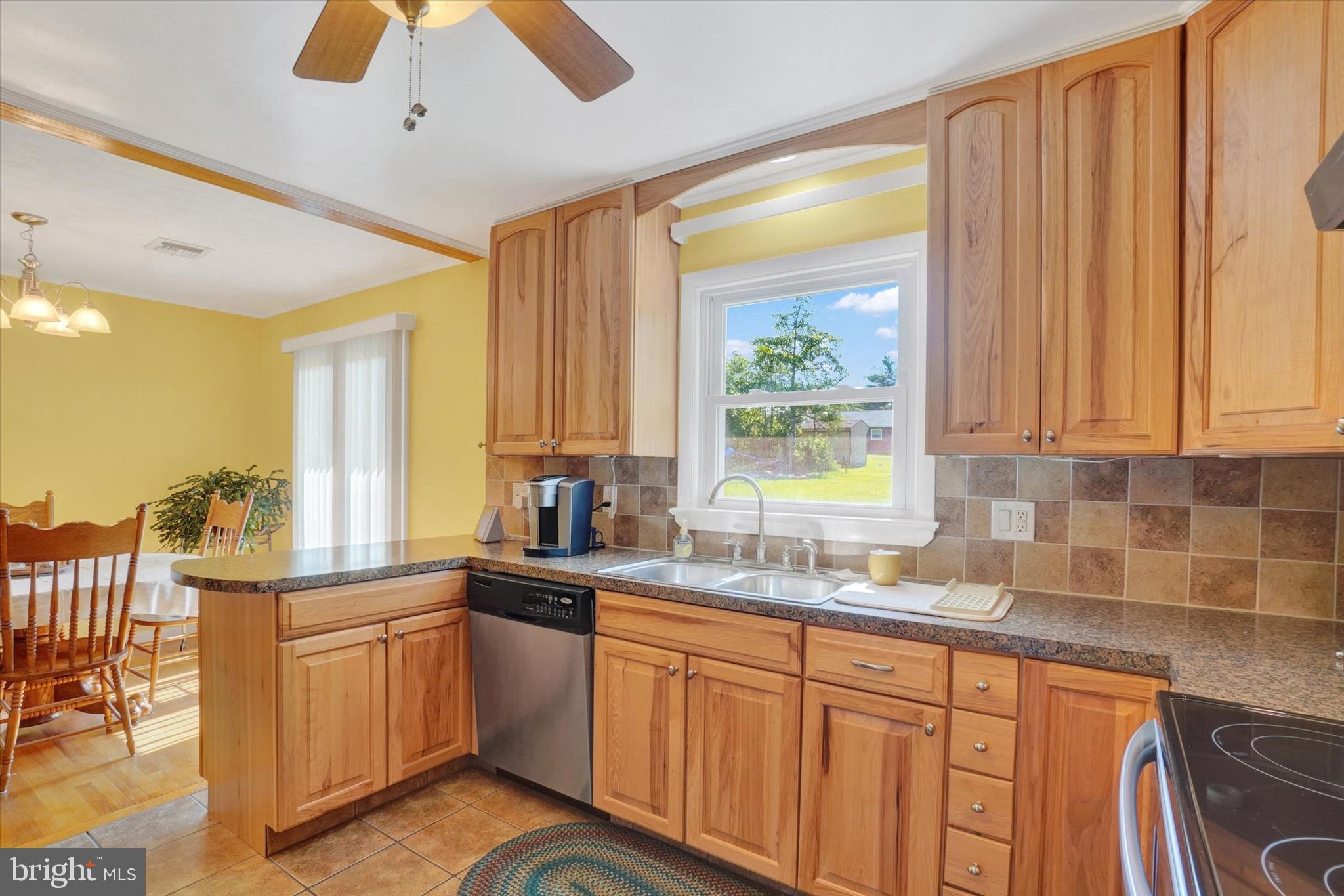 2320 Sycamore Road York, PA 17408 - Photo 8 of 26 a kitchen with stainless steel appliances granite countertop a sink a stove cabinets and wooden floor