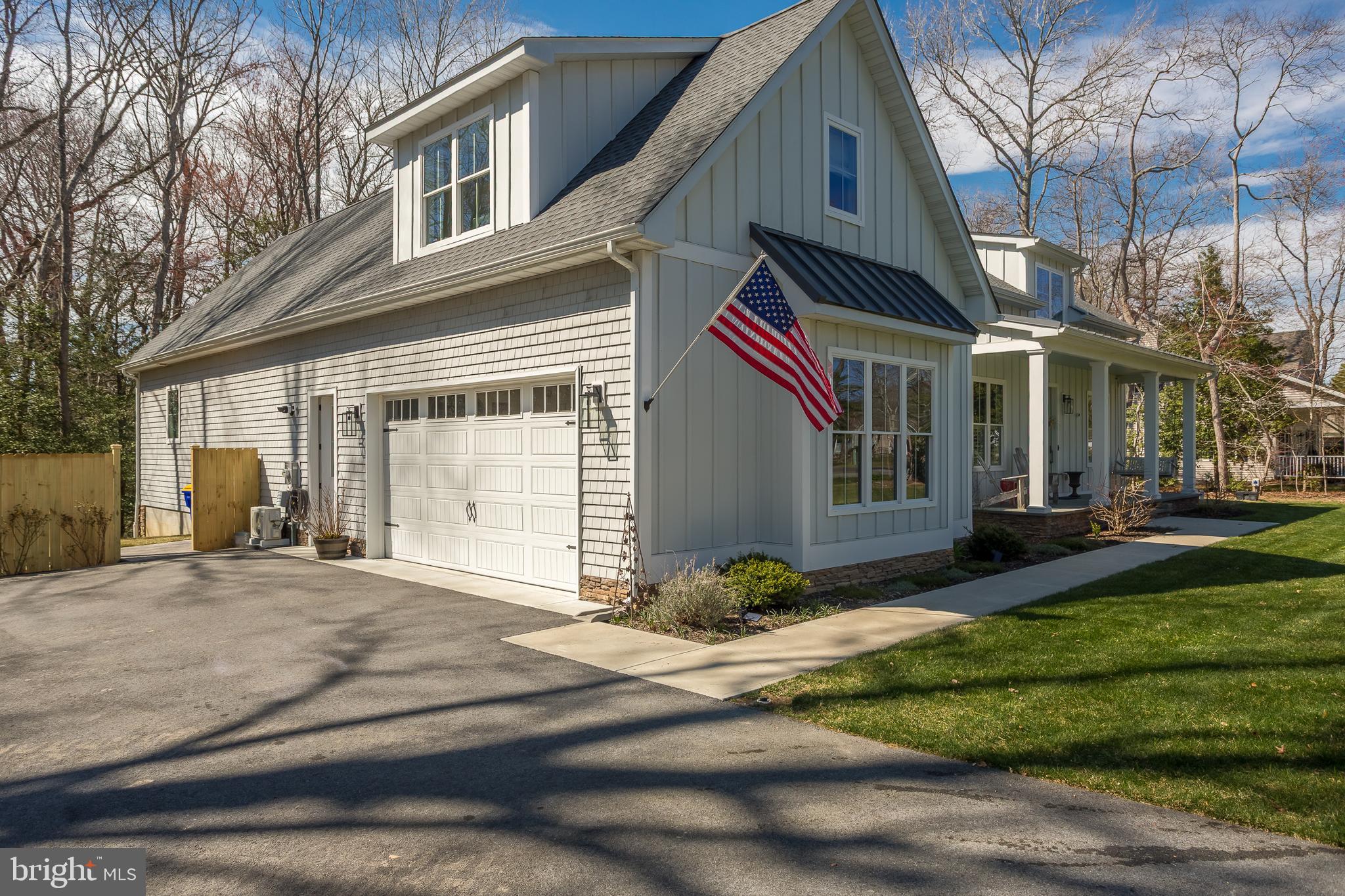 10 Haven Drive Georgetown, DE 19947 - Photo 12 of 76 a front view of a house with a yard outdoor seating and garage